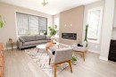 3 Sunrise Heights, Cochrane, AB  - Indoor Photo Showing Living Room With Fireplace 
