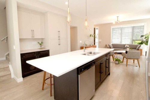 3 Sunrise Heights, Cochrane, AB - Indoor Photo Showing Kitchen With Double Sink
