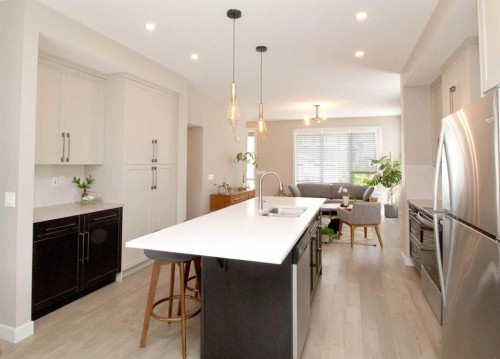 3 Sunrise Heights, Cochrane, AB - Indoor Photo Showing Kitchen With Upgraded Kitchen