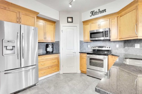 1132-2330 Fish Creek Boulevard Sw, Calgary, AB - Indoor Photo Showing Kitchen With Stainless Steel Kitchen With Double Sink