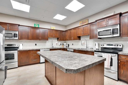 1132-2330 Fish Creek Boulevard Sw, Calgary, AB - Indoor Photo Showing Kitchen With Stainless Steel Kitchen