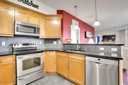 1132-2330 Fish Creek Boulevard Sw, Calgary, AB - Indoor Photo Showing Kitchen With Stainless Steel Kitchen