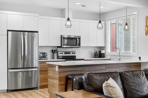 33-230 Seton Passage Se, Calgary, AB - Indoor Photo Showing Kitchen With Stainless Steel Kitchen With Upgraded Kitchen