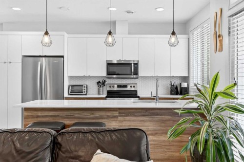 33-230 Seton Passage Se, Calgary, AB - Indoor Photo Showing Kitchen With Stainless Steel Kitchen With Upgraded Kitchen
