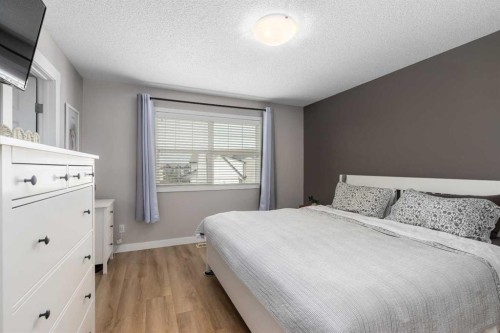 105 Sunset Common, Cochrane, AB - Indoor Photo Showing Bedroom