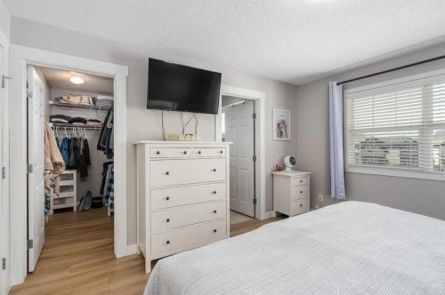 105 Sunset Common, Cochrane, AB - Indoor Photo Showing Bedroom
