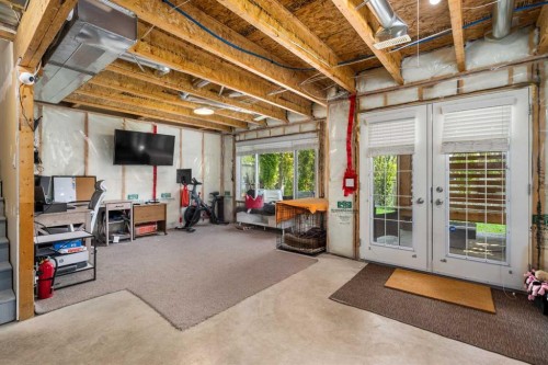 105 Sunset Common, Cochrane, AB - Indoor Photo Showing Basement