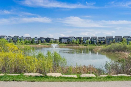 105 Sunset Common, Cochrane, AB - Outdoor With Body Of Water With View