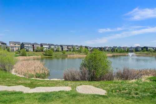 105 Sunset Common, Cochrane, AB - Outdoor With Body Of Water With View
