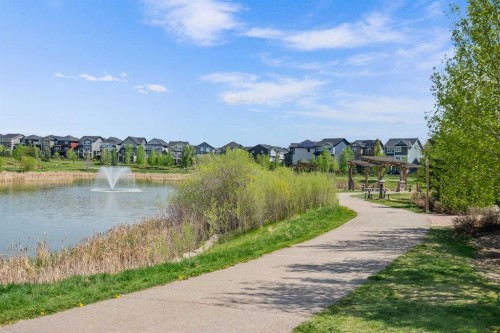 105 Sunset Common, Cochrane, AB - Outdoor With Body Of Water With View