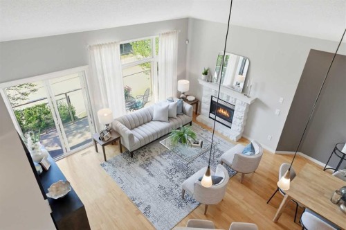 131 Springbank Terrace Sw, Calgary, AB - Indoor Photo Showing Living Room With Fireplace