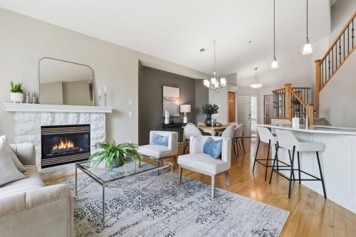 131 Springbank Terrace Sw, Calgary, AB - Indoor Photo Showing Living Room With Fireplace