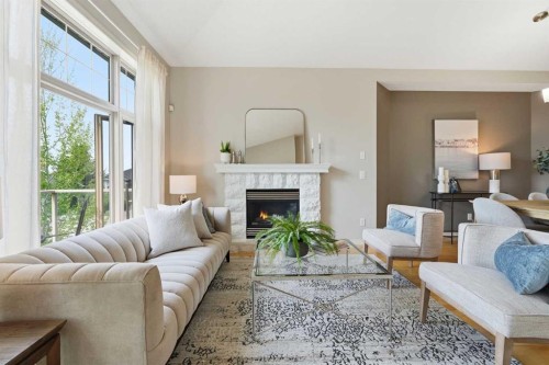 131 Springbank Terrace Sw, Calgary, AB - Indoor Photo Showing Living Room With Fireplace