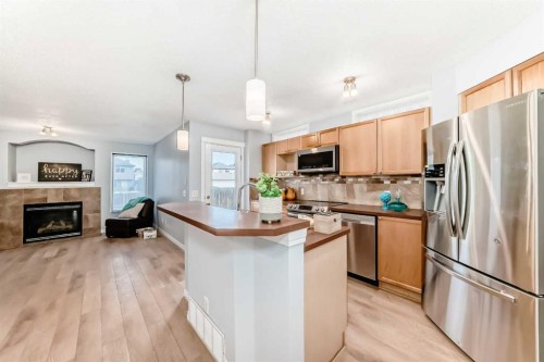 142 Auburn Bay Heights Se, Calgary, AB - Indoor Photo Showing Kitchen With Fireplace With Stainless Steel Kitchen With Upgraded Kitchen