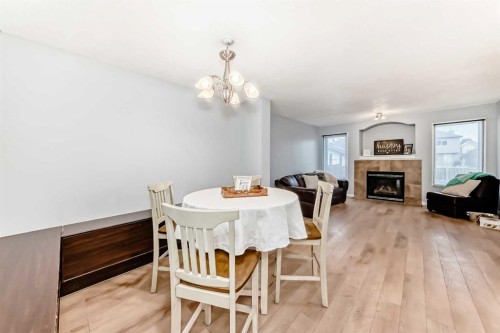 142 Auburn Bay Heights Se, Calgary, AB - Indoor Photo Showing Dining Room With Fireplace