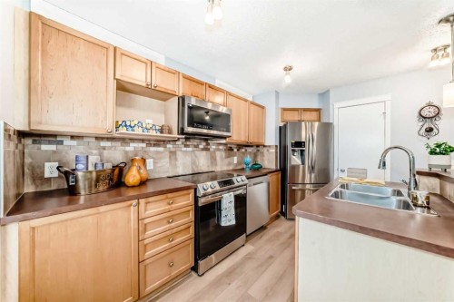 142 Auburn Bay Heights Se, Calgary, AB - Indoor Photo Showing Kitchen With Stainless Steel Kitchen With Double Sink