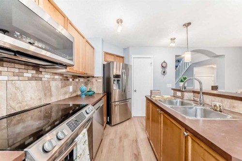 142 Auburn Bay Heights Se, Calgary, AB - Indoor Photo Showing Kitchen With Stainless Steel Kitchen With Double Sink
