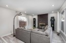 3394 Breton Close Nw, Calgary, AB  - Indoor Photo Showing Living Room With Fireplace 