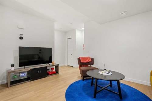 218 Aquila Way Nw, Calgary, AB - Indoor Photo Showing Living Room
