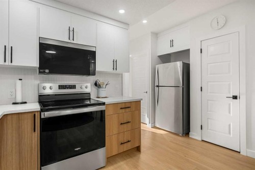 218 Aquila Way Nw, Calgary, AB - Indoor Photo Showing Kitchen With Upgraded Kitchen