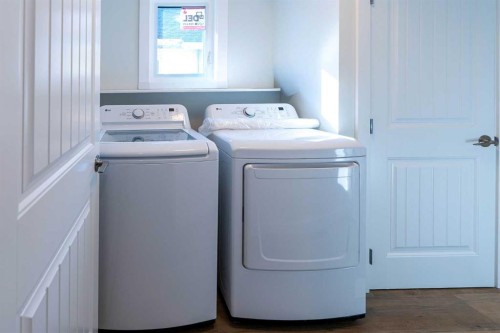 61 Cimarron Way, Okotoks, AB - Indoor Photo Showing Laundry Room