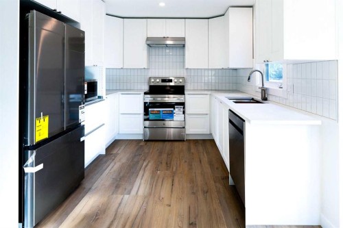 61 Cimarron Way, Okotoks, AB - Indoor Photo Showing Kitchen With Upgraded Kitchen
