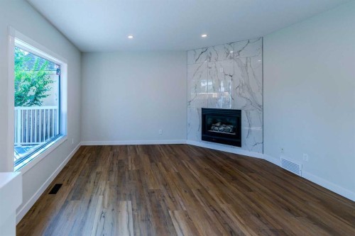 61 Cimarron Way, Okotoks, AB - Indoor Photo Showing Living Room With Fireplace