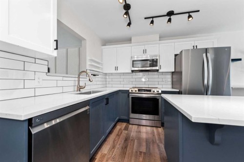140 Cascades Pass, Chestermere, AB - Indoor Photo Showing Kitchen With Upgraded Kitchen