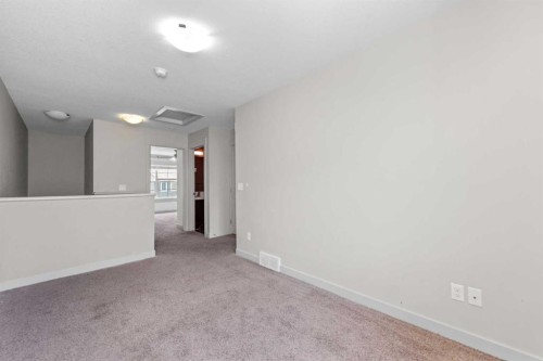 140 Cascades Pass, Chestermere, AB - Indoor Photo Showing Other Room