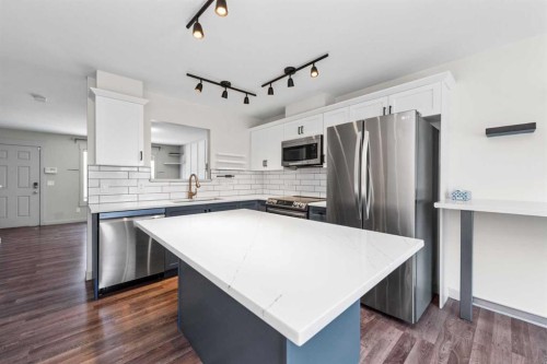 140 Cascades Pass, Chestermere, AB - Indoor Photo Showing Kitchen With Upgraded Kitchen