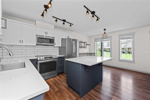 140 Cascades Pass, Chestermere, AB - Indoor Photo Showing Kitchen With Upgraded Kitchen