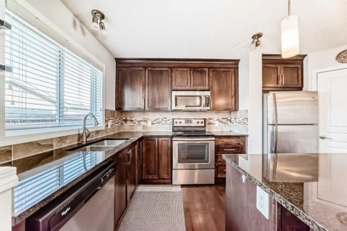 50 Elgin Meadows Park Se, Calgary, AB - Indoor Photo Showing Kitchen With Stainless Steel Kitchen With Double Sink