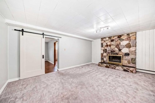 6441 18A Street Se, Calgary, AB - Indoor Photo Showing Other Room With Fireplace