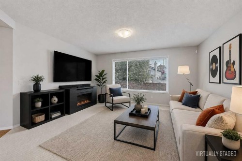 36 Mt Selkirk Close Se, Calgary, AB - Indoor Photo Showing Living Room