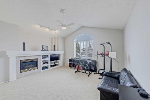 36 Mt Selkirk Close Se, Calgary, AB - Indoor Photo Showing Living Room With Fireplace