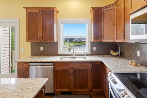 1605 Montgomery Way Se, High River, AB - Indoor Photo Showing Kitchen With Double Sink