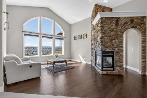 158 Hidden Creek Heights Nw, Calgary, AB - Indoor Photo Showing Living Room With Fireplace