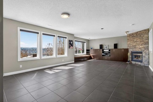 158 Hidden Creek Heights Nw, Calgary, AB - Indoor With Fireplace