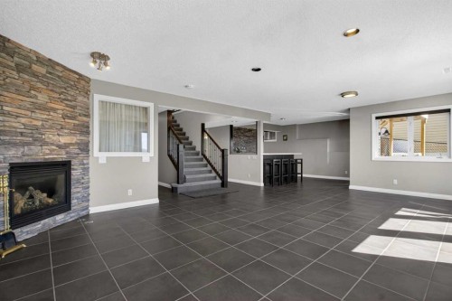 158 Hidden Creek Heights Nw, Calgary, AB - Indoor Photo Showing Living Room With Fireplace