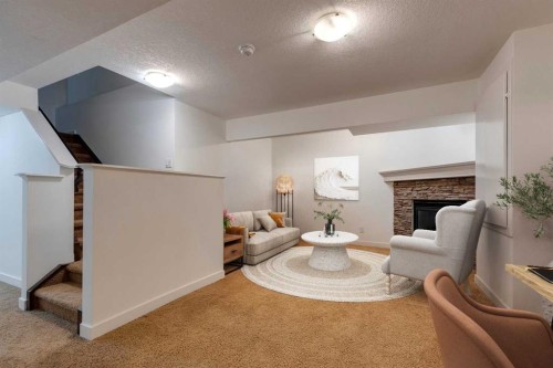 107 Aspen Stone Crescent Sw, Calgary, AB - Indoor With Fireplace