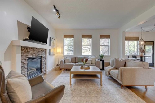 107 Aspen Stone Crescent Sw, Calgary, AB - Indoor Photo Showing Living Room With Fireplace
