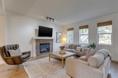 107 Aspen Stone Crescent Sw, Calgary, AB - Indoor Photo Showing Living Room With Fireplace