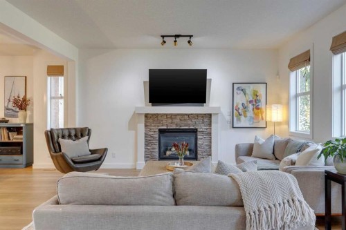 107 Aspen Stone Crescent Sw, Calgary, AB - Indoor Photo Showing Living Room With Fireplace