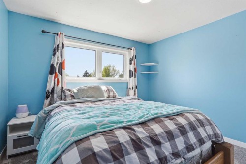 804 Downey Place, Okotoks, AB - Indoor Photo Showing Bedroom