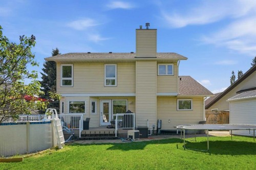 804 Downey Place, Okotoks, AB - Outdoor With Above Ground Pool With Deck Patio Veranda