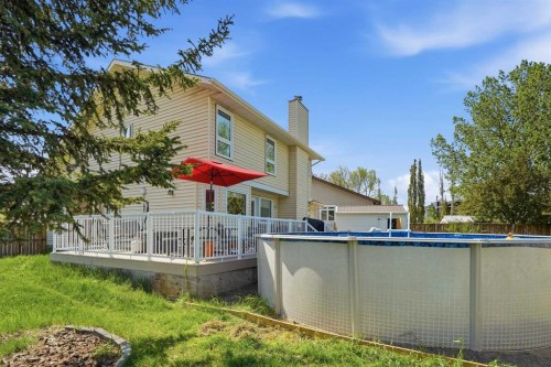 804 Downey Place, Okotoks, AB - Outdoor With Above Ground Pool