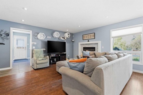 804 Downey Place, Okotoks, AB - Indoor Photo Showing Living Room With Fireplace