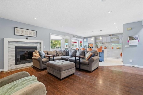 804 Downey Place, Okotoks, AB - Indoor Photo Showing Living Room With Fireplace