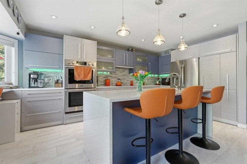 804 Downey Place, Okotoks, AB - Indoor Photo Showing Kitchen With Stainless Steel Kitchen With Upgraded Kitchen