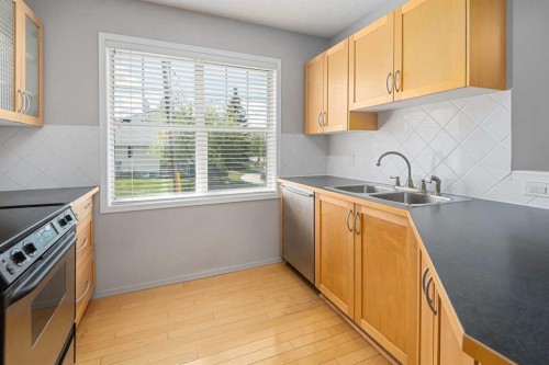 2504-7171 Coach Hill Road, Calgary, AB - Indoor Photo Showing Kitchen With Double Sink